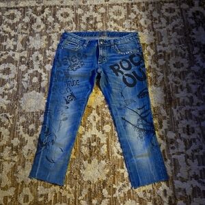 Rerock by Express.  Size 2 capri jeans. Blue with black print.